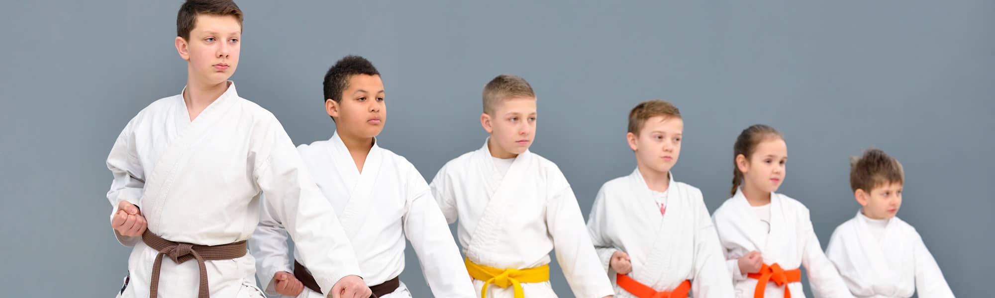 Line up of kids in Rhyl Karate dojo